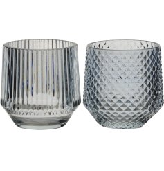 An assortment of 2 decorative glass candle holders in stripe and diamond designs.