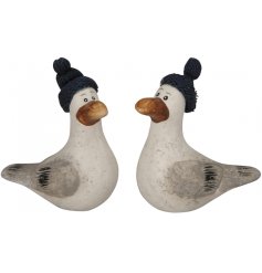 A mix of 2 charming seagull ornaments, each with a navy blue knitted hat.