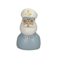 A charming captain ornament with cute details and a rustic finish.