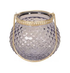A chic glass lantern with diamond cut glass and gold metal handle. Complete with decorative gold rim. 