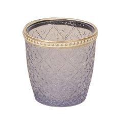 A pretty glass votive with a floral design and decorative gold band. 