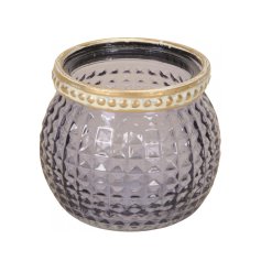 A stylish glass t-light holder with square ridged glass and a decorative gold band. 
