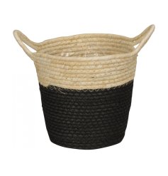 A stylish woven basket with black band. Complete with handles and lining. A multi-purpose accessory for the home. 