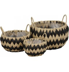 A set of 3 woven baskets with a bold zig zag design. Complete with lining and carry handles.