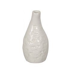 A unique ceramic vase with a pressed flower detail. With a handmade aesthetic this vessel is full of character and charm