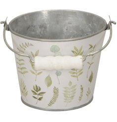 A stylish zinc planter with handle. Wrapped with a stunning plant variety watercolour print. 