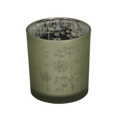 A beautiful matte green glass candle holder with a pretty floral design. 