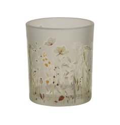 A beautiful smoked glass candle holder with a whimsical wild meadow design. 