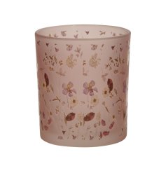 A frosted glass candle holder in pink with an abundance of pretty floral decals.