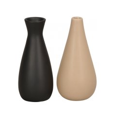 An assortment of black and cream contemporary vases. A chic, sculptural vessel for the home.
