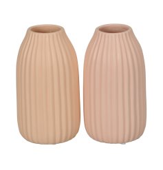 A mix of 2 ribbed vases in classic peach and pink pastel colours. A fresh interior accessory for the home this season.