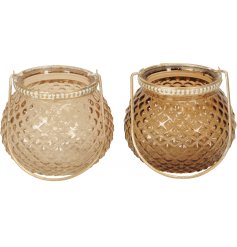 An assortment of 2 honey and natural coloured glass vases, each with a vintage gold handle. 
