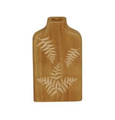 A chic wooden vase with a stylish fern print carved into the surface. 