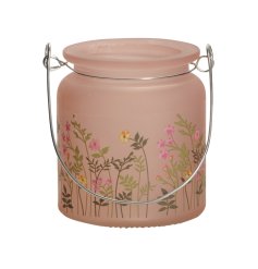A pretty pink lantern with an abundance of colourful wild flowers decorating the surface.