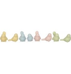 A mix of 8 pretty pastel coloured ceramic birds, each with a rustic finish. 