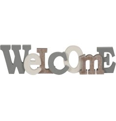 A stylish wooden Welcome sign with a washed natural and painted finish.