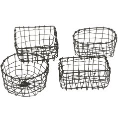 An assortment of 4 rustic metal baskets in oval, round, square and rectangular shapes. 