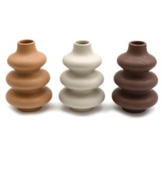 An assortment of 3 stylish ribbed vases in a mix of natural colours. 