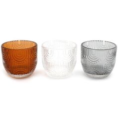 Toffee, clear and grey coloured glass t-light holders with a contemporary rainbow design. 
