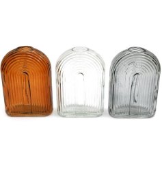 An assortment of 3 glass vases in caramel, grey and clear glass colours. A chic and unique interior accessory.