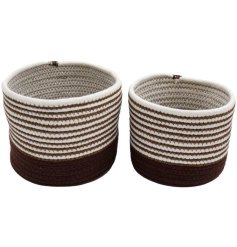A set of 2 stylish storage baskets. Woven with white and brown they make a chic interior item for the home.