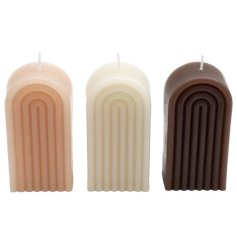 A mix of 3 contemporary rainbow candles in pink, cream and brown neutral hues. 