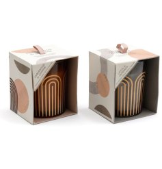 An assortment of 2 beautifully scented candles set within stylish abstract glass pots. 