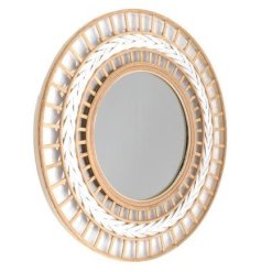 A stylish natural and white woven rattan mirror. A chic interior accessory for the home. 