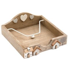 A chic wooden napkin holder decorated with miniature wooden houses and hearts 