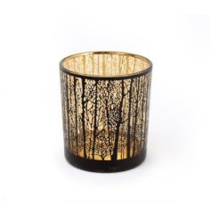 A stylish black and gold candle holder with a contemporary trees design.