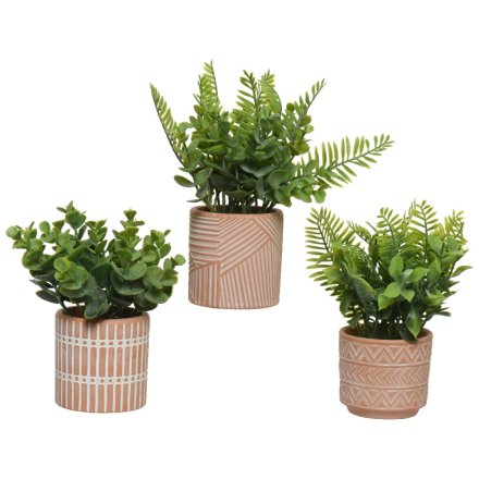 A mix of 3 artificial houseplants set within beautifully patterned pots. 