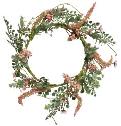 A pretty artificial wreath bursting with an abundance of pink berries and flowers.