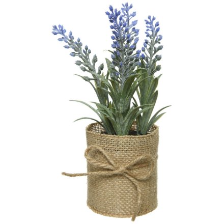 A rustic living artificial lavender plant set within a jute presentation pot with bow. 