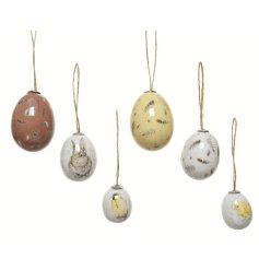 A charming collection of multi-sized egg decorations, each with a speckled design and glossy finish.