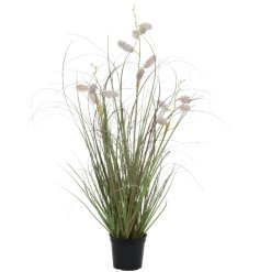 A black pot with large artificial grasses. A fine quality artificial house plant for the home.