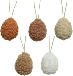 An assortment of teddy fabric eggs in a mix of colours including white, terracotta and beige. 