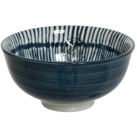 A glossy navy blue and white bowl with a tie dye inspired print.
