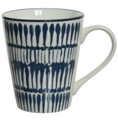 A stylish and unique printed mug with a handmade aesthetic. Complete with a glossy blue print.