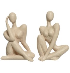A mix of 2 chic sculptural figures in cream. Each has a handmade aesthetic and is a unique item for the home 