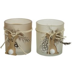 A mix of 2 opaque glass candle holders with cute wooden bunnies. Complete with pom pom tails and decorative feathers. 