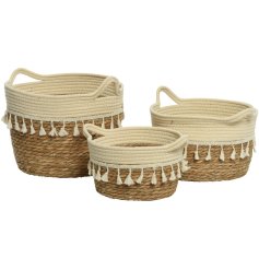 A set of 3 bohemian inspired storage baskets. Handmade with tassels and woven sea grass. 