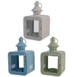 An assortment of 3 square lanterns with t-light holder. The assortment includes stylish grey, blue and green hues. 