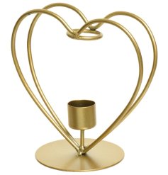 A unique candlestick holder with an iron heart. A stylish gift item and interior accessory. 