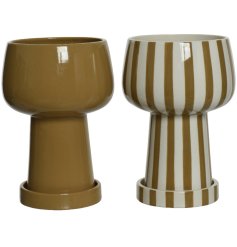An assortment of 2 cool and contemporary camel coloured planters in plain and striped designs. Complete with plant dish.