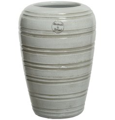 A chic handmade vase with a rustic stripe pattern and rich cream glaze. 