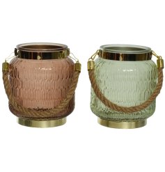 An assortment of 2 textured glass lanterns in green and brown colours. Each has gold detailing and a chunky rope handle
