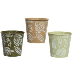 An assortment of 3 green and camel coloured zinc planters. Each is embossed with a bold leaf print decoration.