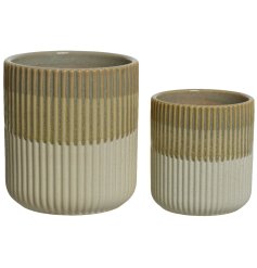 A set of 2 handmade stoneware planters with a tonal glazed finish. 