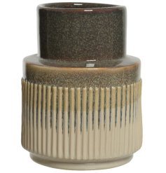 An attractive handmade stoneware vase with ribbed detailing and a shiny glaze in on trend neutral colours. 