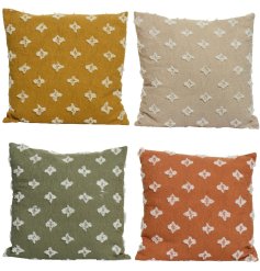 An assortment of 4 soft cotton cushions with white tufting detail.